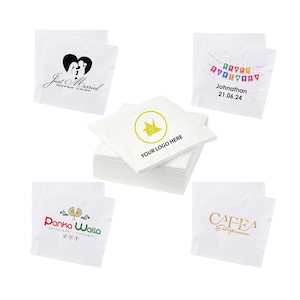 May include: A stack of white paper napkins with various printed designs. Some napkins feature text like "Just Married" and "Happy Birthday," while others display logos. The napkins are suitable for events and businesses.