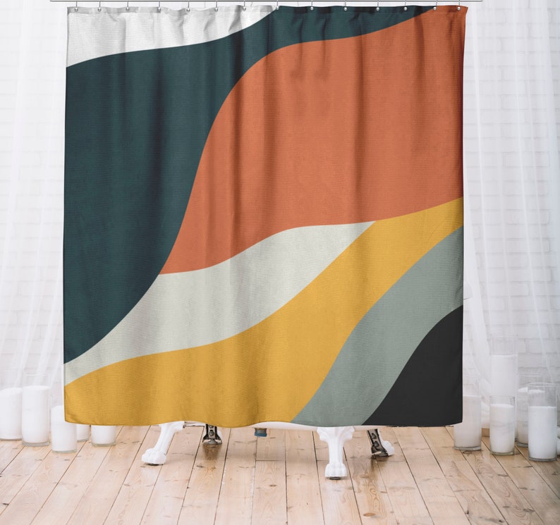 May include: Abstract shower curtain with a design of wavy lines in shades of teal, orange, yellow, and white.