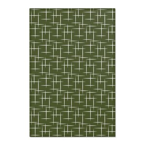May include: A green kitchen towel with a white geometric pattern of intersecting lines.
