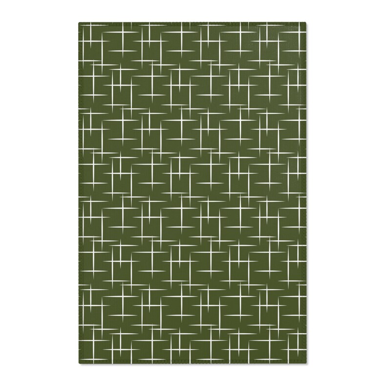 May include: A green kitchen towel with a white geometric pattern of intersecting lines.