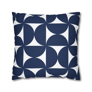 May include: A navy blue and white geometric cushion with a repeating pattern of semi-circles.