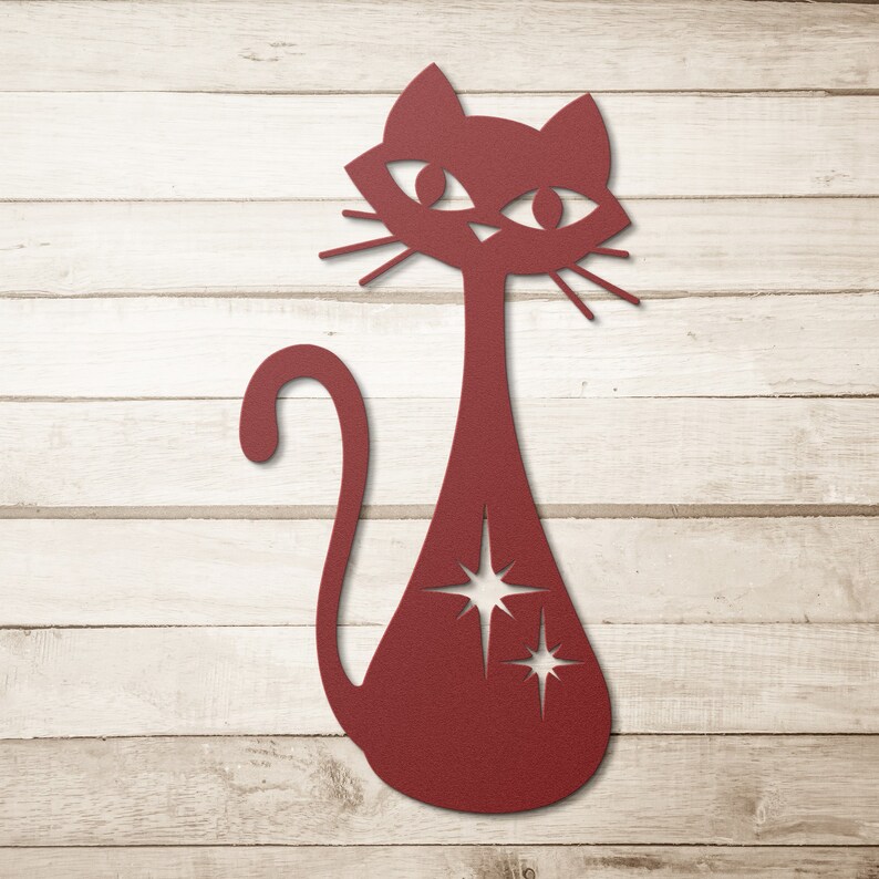 May include: A red silhouette of a cat with a starburst design on its body. The cat is facing forward with its tail curled around its body.