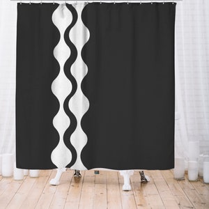 May include: Black and white shower curtain with a wavy pattern on the left side.