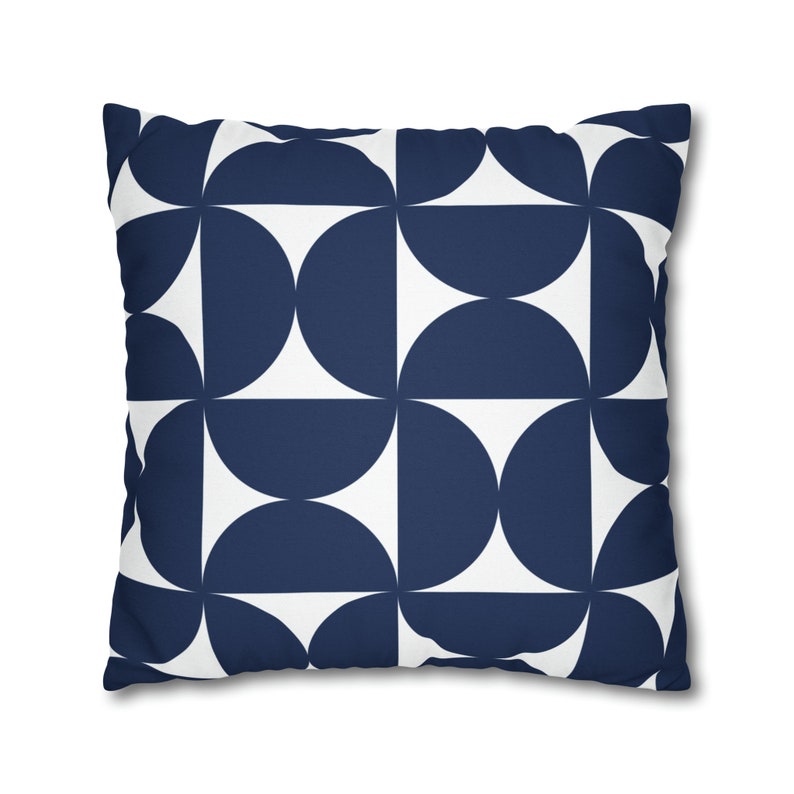 May include: A navy blue and white geometric patterned cushion. The cushion features a repeating pattern of semi-circles.
