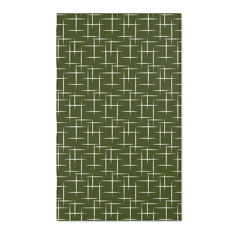 May include: A green fabric with a white geometric pattern of intersecting lines.