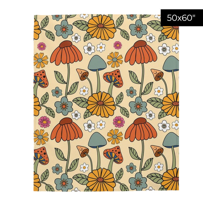 May include: A beige blanket with a repeating pattern of orange, yellow, and blue flowers, mushrooms, and leaves. The blanket measures 50x60 inches.
