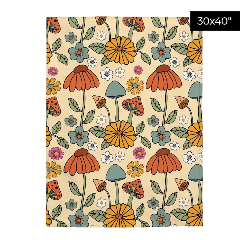 May include: A cream-colored blanket with a repeating pattern of orange, yellow, and blue flowers, mushrooms, and leaves. The blanket measures 30 x 40 inches.