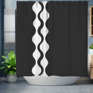 May include: Black and white shower curtain with a wavy pattern on the left side.