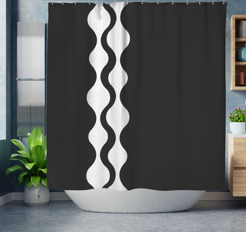 May include: Black and white shower curtain with a wavy pattern on the left side.
