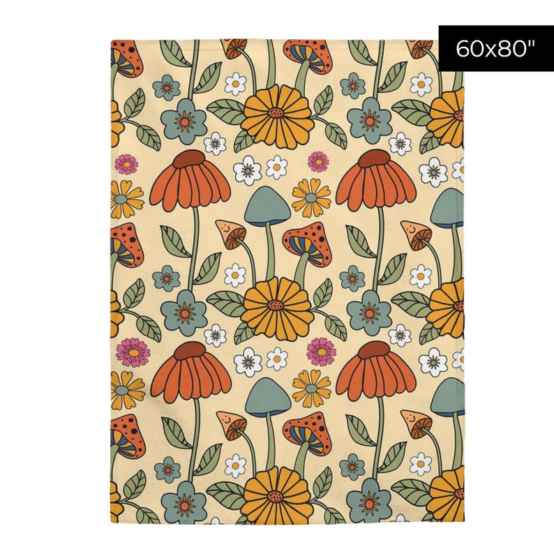 May include: A beige blanket with a repeating pattern of orange, yellow, and blue mushrooms, flowers, and leaves. The blanket measures 60x80 inches.