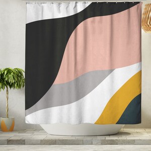 May include: Abstract shower curtain with a design of wavy lines in black, pink, gray, white, and yellow.