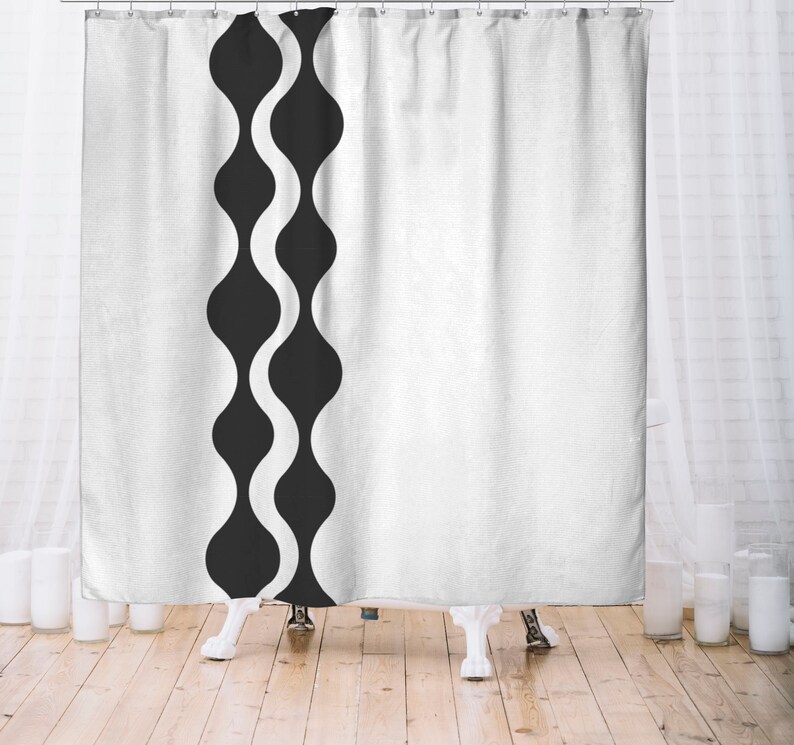 May include: White shower curtain with a black and white wavy pattern along the left edge.