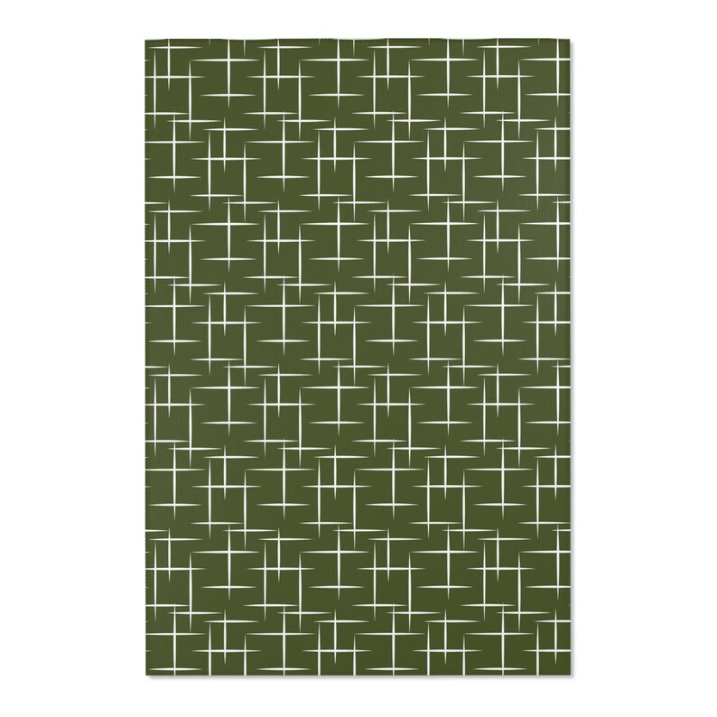 May include: A green fabric with a white geometric pattern of overlapping lines forming a grid.
