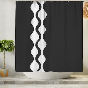 May include: Black and white shower curtain with a wavy pattern on the left side.
