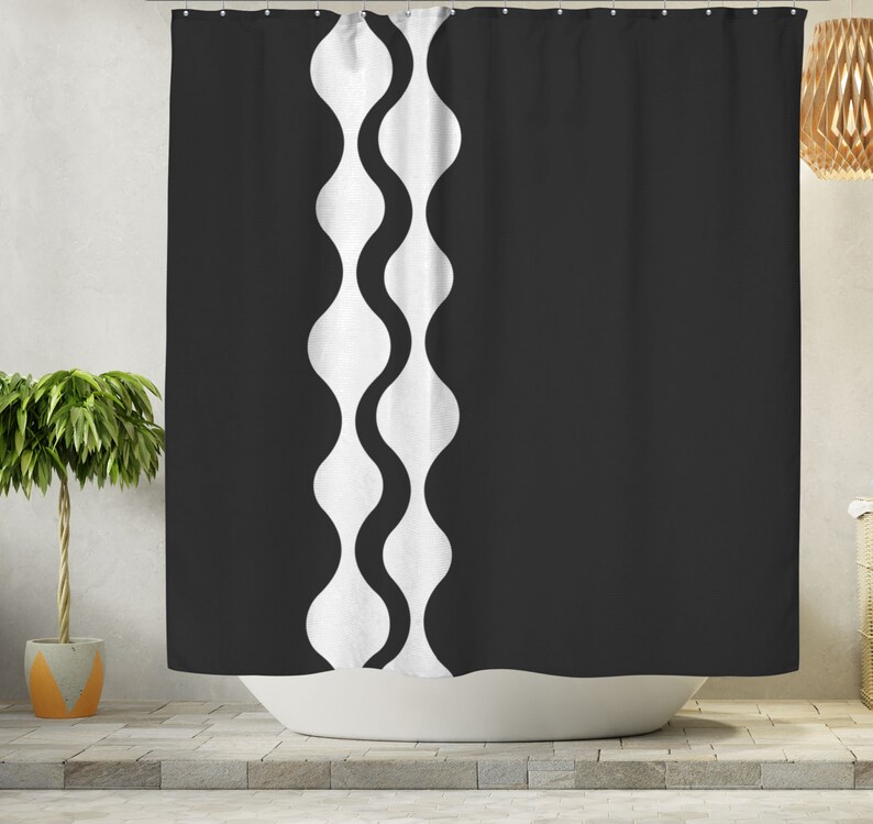 May include: Black and white shower curtain with a wavy pattern on the left side.