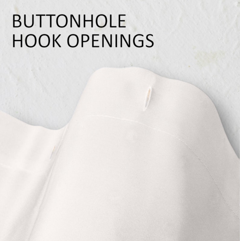 May include: Close-up of white fabric with the text "BUTTONHOLE HOOK OPENINGS" at the top. The fabric has a buttonhole opening. The fabric is likely part of a garment or home textile.