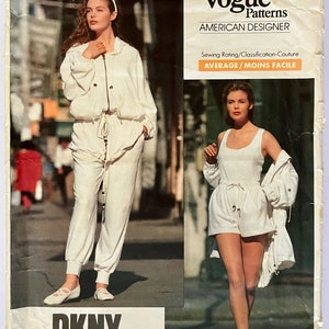 May include: A vintage Vogue Patterns sewing pattern featuring a white DKNY outfit. The pattern is for a jacket and trousers or shorts. The pattern is labelled "American Designer" and "Average/Moins Facile". The pattern number is 2453.