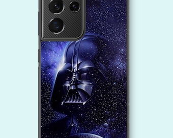 May include: A black phone case with a dark blue and black image of Darth Vader in space. The case has a black camera bump with three lenses.