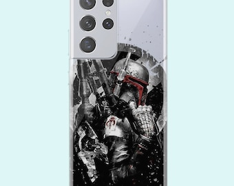 May include: A clear phone case with a black and white image of a Star Wars character, Boba Fett, with a red and white symbol on his chest. The background is a black and white splatter pattern.