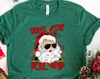 Don't Stop Believing Shirt, Women's Graphic Tee, Christmas Shirt, Santa Tee, Women's Christmas Shirt, Santa Claus Shirt, Funny Christmas Tee