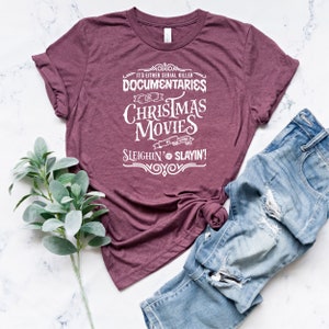 May include: Burgundy t-shirt with white text that reads "It's either serial killer documentaries or Christmas movies, we either sleighin' or slayin'"