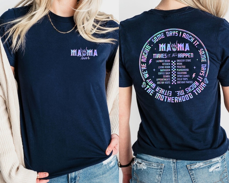 May include: A navy blue t-shirt with a graphic print of the text "Mama Tour" on the front and a graphic print of the text "Some days I rock it. Some days it rocks me. The Motherhood Tour" on the back.