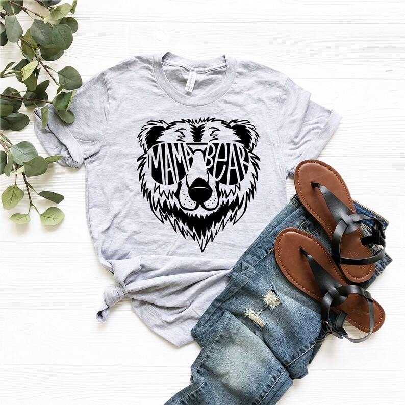 May include: Gray t-shirt with a black bear graphic wearing sunglasses that say "Mama Bear".