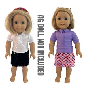 May include: Two dolls wearing different outfits. One doll is dressed in a white polo shirt, a black skirt, and a red headband. The other doll is wearing a purple shirt and a plaid skirt. The text "AG DOLL NOT INCLUDED" is on the right side.