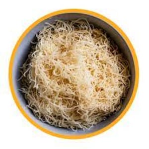 May include: A bowl of thin, white, shredded pastry, known as kataifi, used in making desserts like baklava.