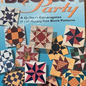 May include: A softcover book titled Marsha McCloskey's BLOCK Party: A Quilter's Extravaganza of 120 Rotary-Cut Block Patterns. The light blue cover features a collage of various square fabric quilt blocks in diverse colors and geometric patterns.