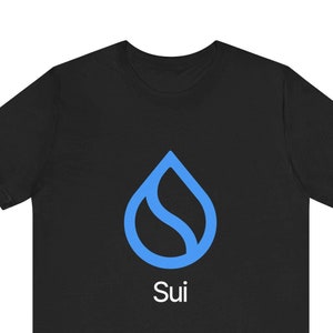 May include: Black t-shirt featuring a blue water drop logo and the word "Sui" in white text.