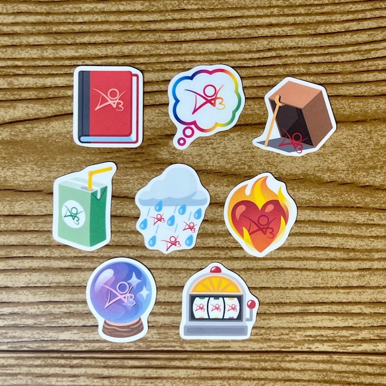 May include: Nine colorful stickers with a red, white, and blue logo featuring a stylized figure with wings. The stickers depict a book, a thought bubble, a box, a juice box, a cloud with raindrops, a heart, a crystal ball, a slot machine, and a heart.
