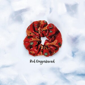 May include: Red scrunchie with a gingerbread man pattern.