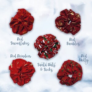 May include: Five red scrunchies with different Christmas-themed patterns. The patterns include snowflakes, baubles, reindeer, holly, and Santa hats and socks.