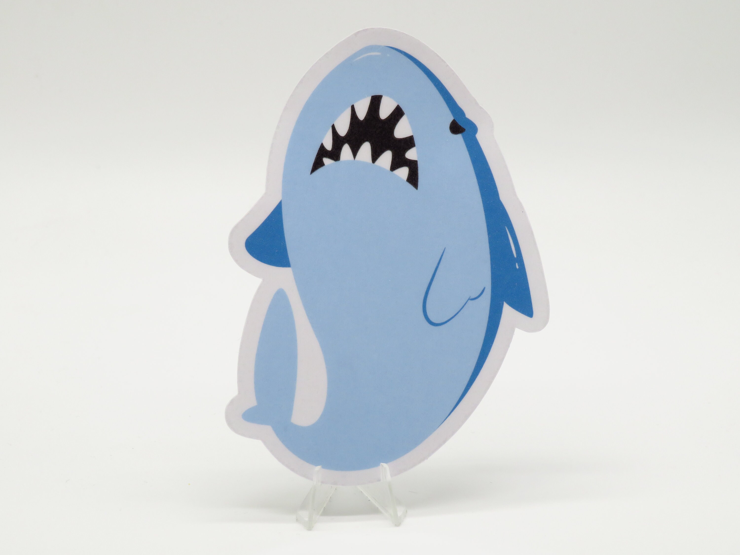 bridget from guilty gear finds a blue shark plush in a