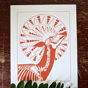 May include: A red and white print of a stylized animal skeleton with a geometric pattern behind it. The print is signed "Leila Rosenfelt".