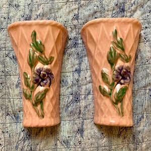 2 vintage ceramic wall pockets with pink glaze and floral design