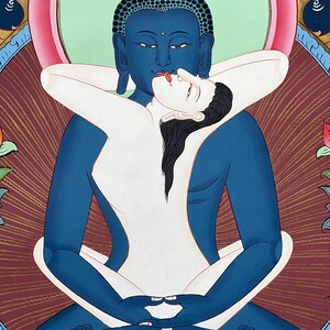 May include: A thangka painting depicting a blue-skinned deity in a meditative pose, embracing a pale-skinned figure. The figures are intertwined in a central position against a dark red background with golden rays, framed by decorative floral elements.