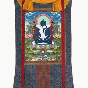 May include: A vertical wall hanging scroll featuring a central thangka painting of a blue deity embracing a white figure in a lotus position. The artwork is framed by a blue and red patterned fabric border with a yellow silk top header and ribbon.