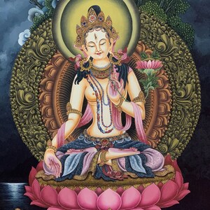 May include: A painting of a deity sitting in a lotus position on a pink lotus flower. The deity is adorned with jewelry and has a serene expression. The background is dark blue with a moon and clouds.