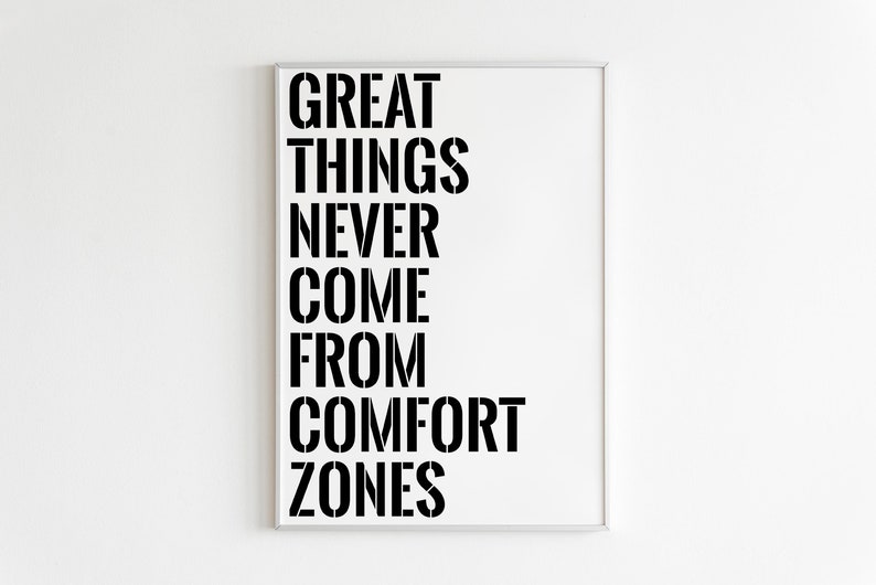 May include: A white framed poster with black text that reads "GREAT THINGS NEVER COME FROM COMFORT ZONES".