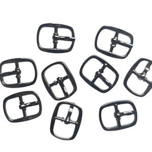 Pequeñas piezas metálicas: hebillas, cierres, anillas - precio por pieza