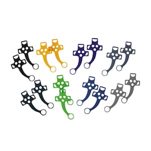 May include: A collection of eight pairs of flat, cross-shaped zipper pulls in various colors including black, yellow, dark blue, grey, dark green, and bright green. Each pull features a central cross design with four circular cutouts and a curved tail.