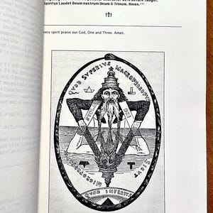 May include: Black and white illustration from a book, featuring a bearded figure within an oval frame. The figure is surrounded by text and symbols, including a star and a serpent. The image is on a white page.