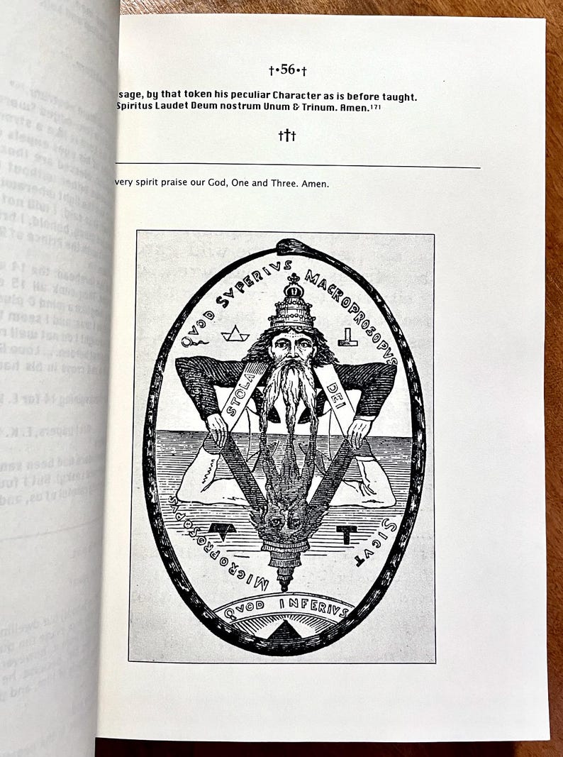 May include: Black and white illustration from a book, featuring a bearded figure within an oval frame. The figure is surrounded by text and symbols, including a star and a serpent. The image is on a white page.