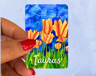 Pegatina de vinilo con acuarela del signo zodiacal Tauro con tulipán de rayas rojas y constelación nocturna.