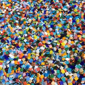 May include: A large collection of colorful, square glass tiles. The tiles are arranged in a random pattern and are of various sizes.