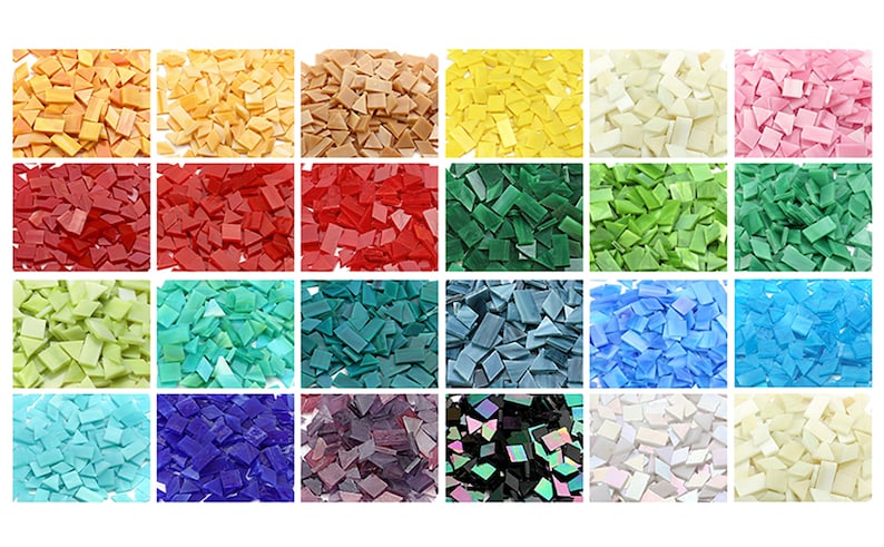 May include: Assortment of 24 colors of glass mosaic tiles. Each color is shown in a separate square. The tiles are irregular in shape and size, with some being square, rectangular, and triangular.