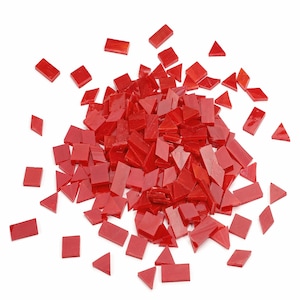 May include: A large pile of red glass mosaic tiles in various shapes, including squares and triangles. The tiles are scattered on a white background.