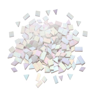 May include: A pile of iridescent white and light pink mosaic tiles in various shapes, including squares, rectangles, and triangles.